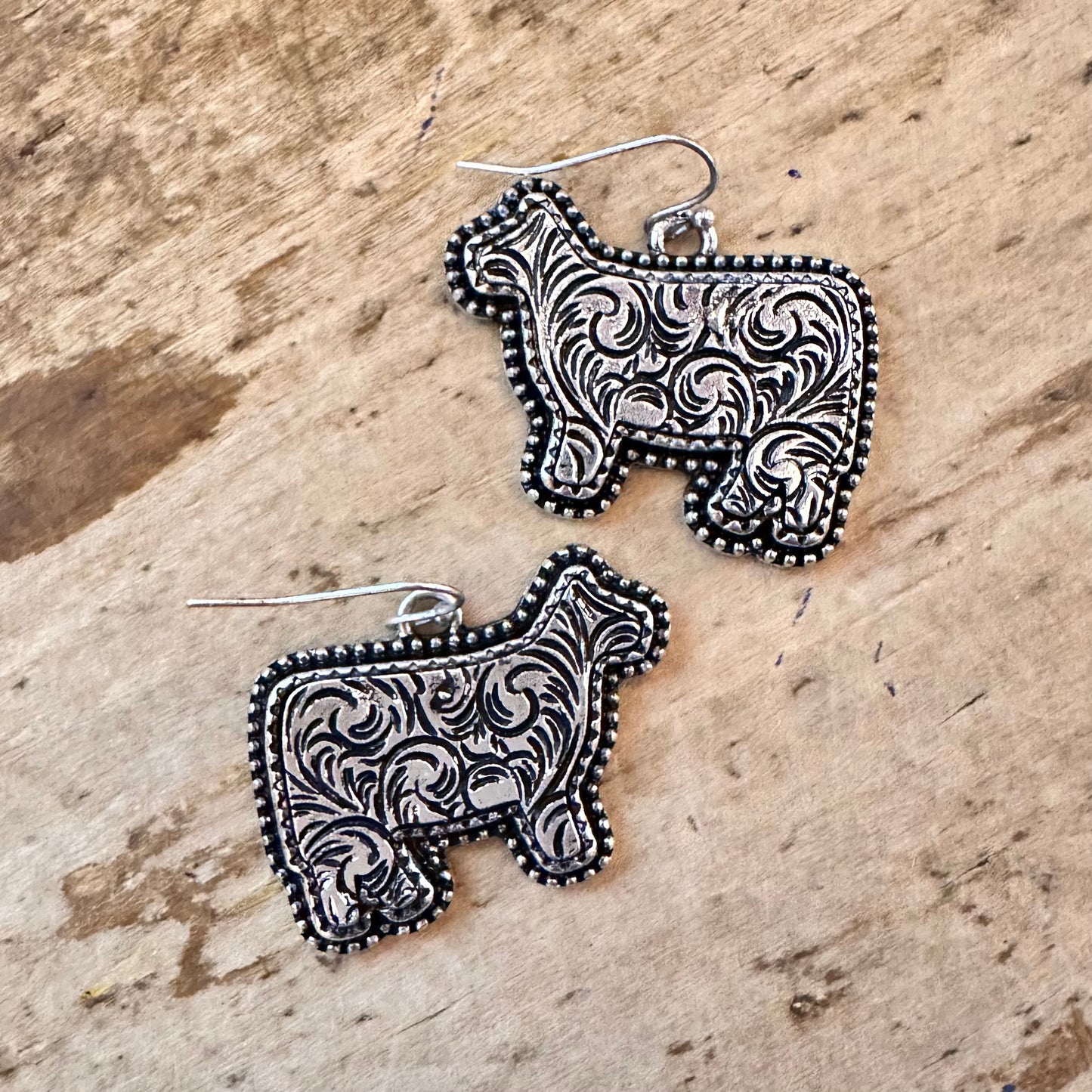Tooled Cow Shaped Dangle Earrings