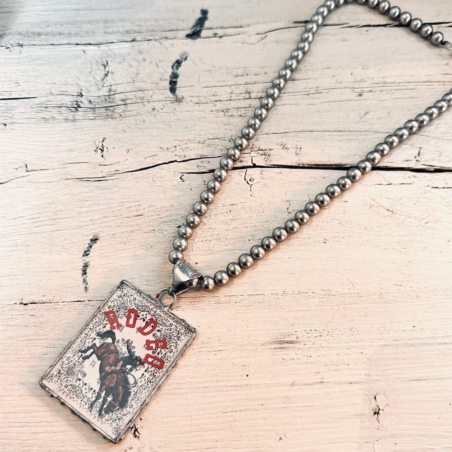 8mm Pewter Pearl Necklace with Rodeo Buckin Horse Pendant