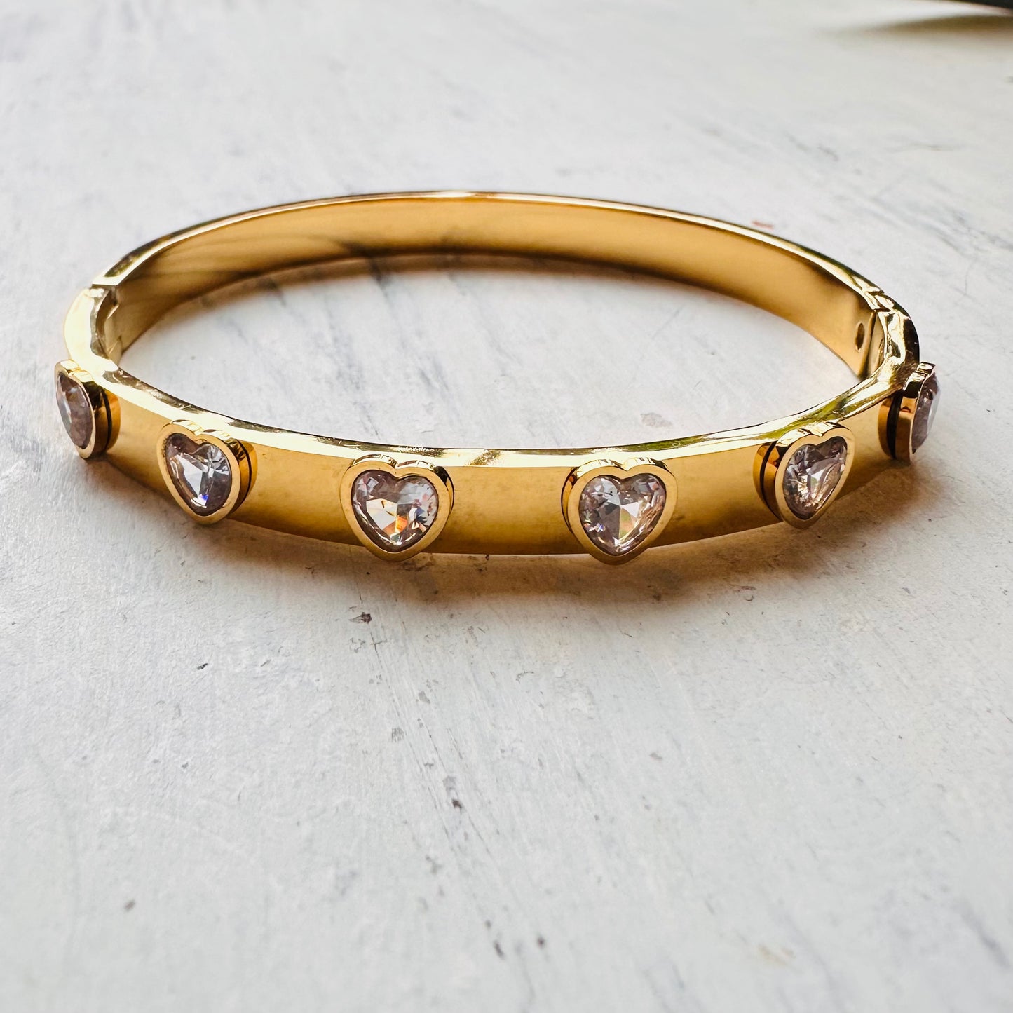 Shiny Gold Bangle with Heart CZ Stones