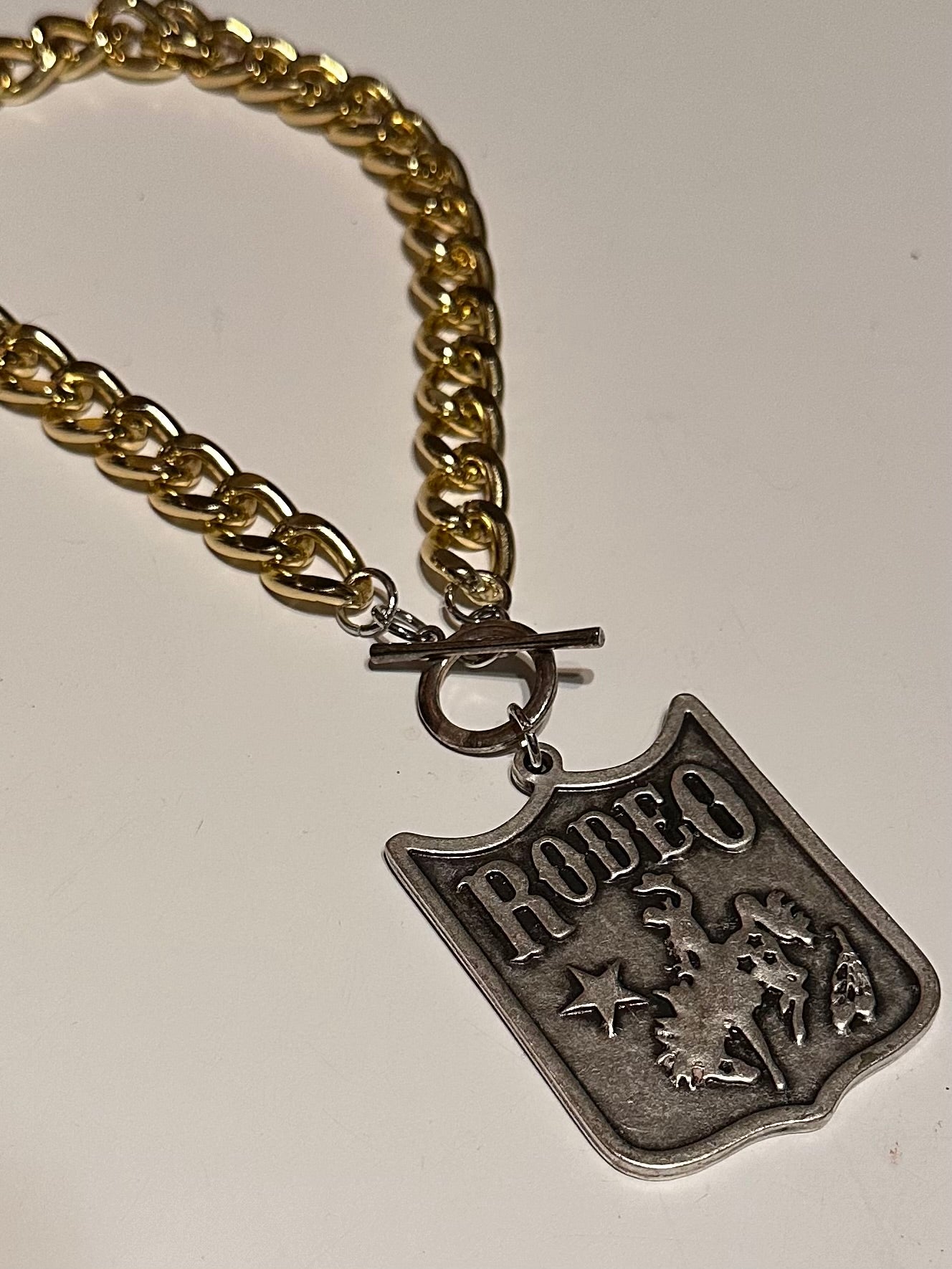 Gold Chunky Chain & Rodeo Badge Pendant