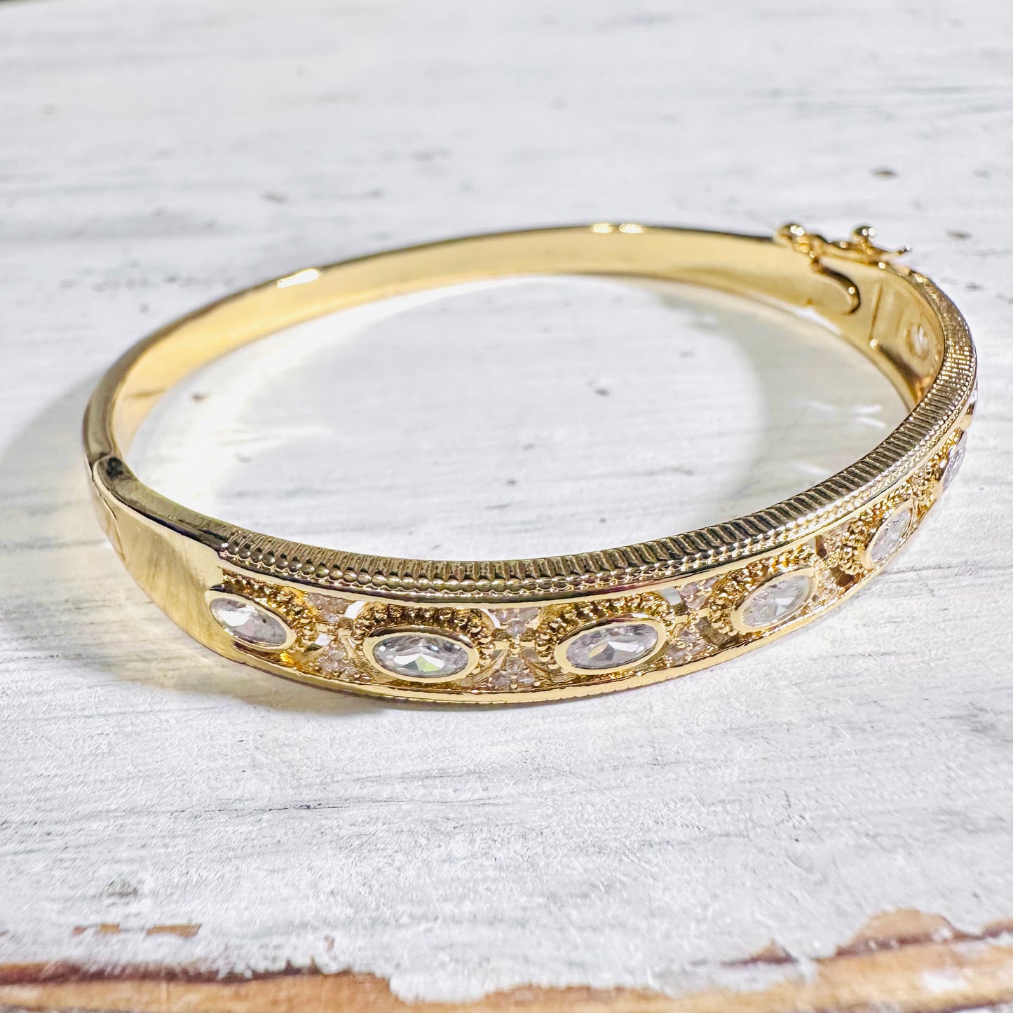 Gold Filagree Oval Rhinestone Hinge Bangle