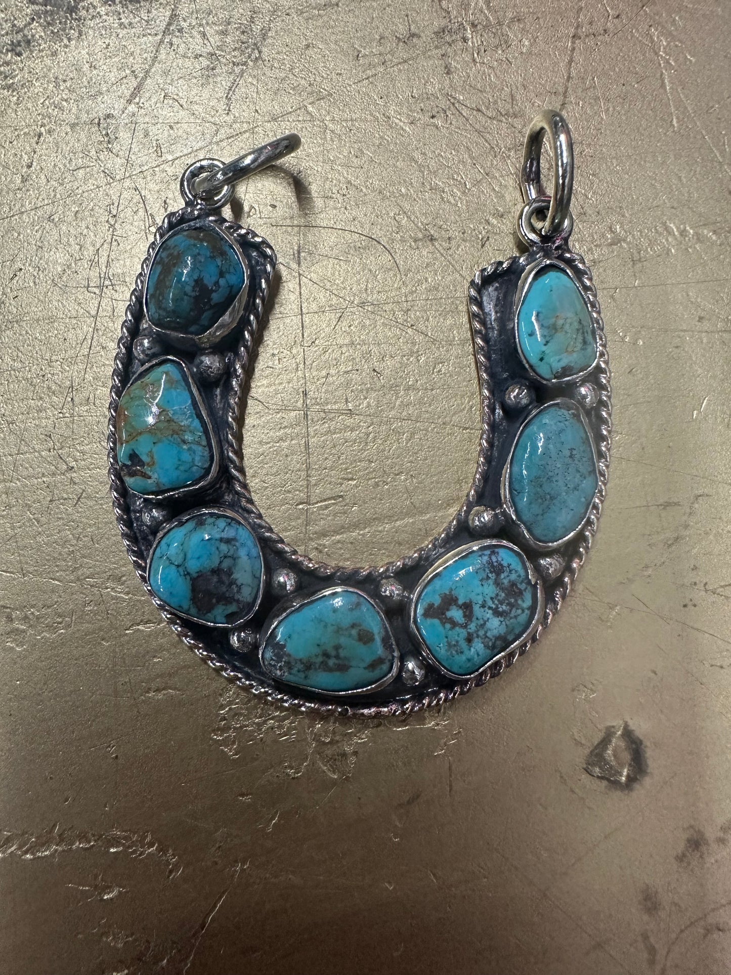 Turquoise Seven Stone Horseshoe Pendant with double bell